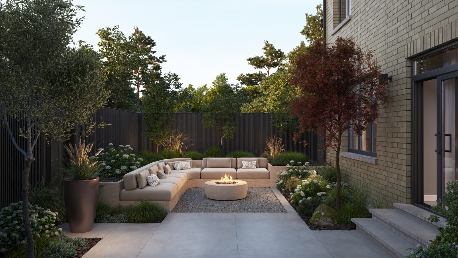 Landscaped backyard with lounge seating at a Five Oaks home