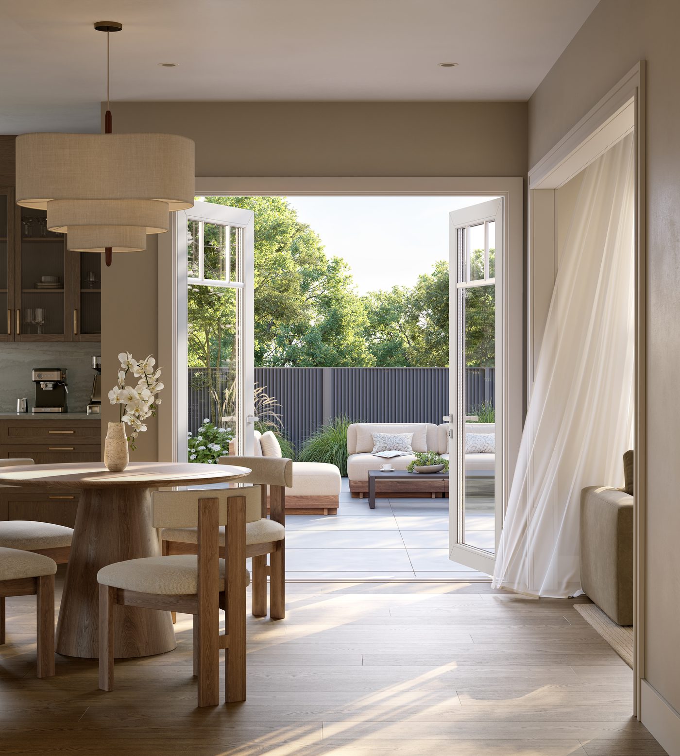 Sunlit breakfast area opening to the backyard in a Five Oaks single
